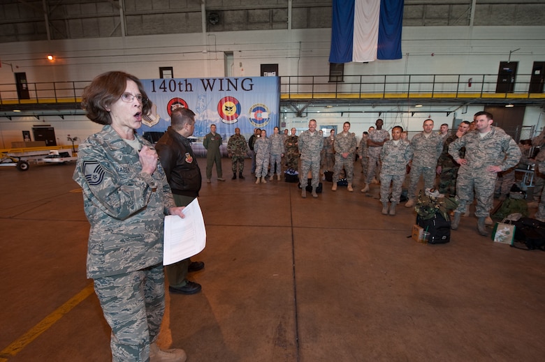 Senior Master Sgt. Linda Baden, Health Services Manager for the Colorado Air National Guard’s 140th Medical Group, Buckley Air Force Base, turns over control of personnel to U.S. Air Force Lt. Col. Paul Shingledecker, Commander, 140th Medical Group, March 13, 2010. Shingledecker is leading a more than 60-person team supporting the Office of the Assistant Secretary of Defense for Reserve Affairs Innovative Readiness Training Program E Malama Kakou (translated from Hawaiian as “to care for all”). (U.S. Air Force photo/Master Sgt. John Nimmo, Sr.) (RELEASED)
 
