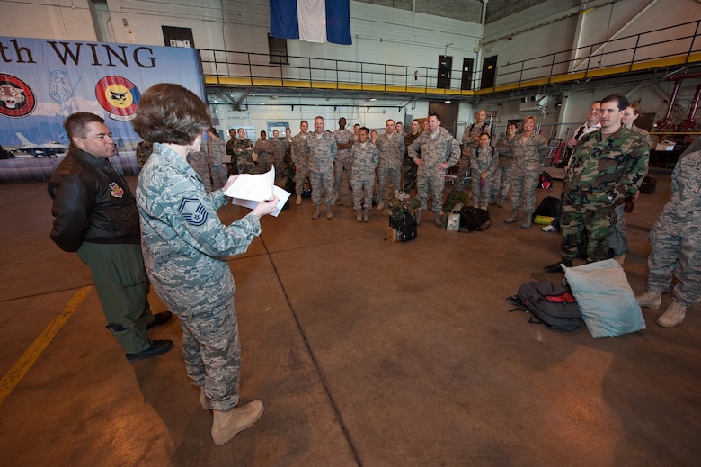 Senior Master Sgt. Linda Baden, Health Services Manager for the Colorado Air National Guard’s 140th Medical Group at Buckley Air Force Base, conducts roll-call in preparation for the groups departure to Honolulu, March 13, 2010. Baden is part of a more than 60-person team supporting E Malama Kakou (translated from Hawaiian as “to care for all”). E Malama Kakou is part of the Office of the Assistant Secretary of Defense for Reserve Affairs Innovative Readiness Training Program. (U.S. Air Force photo/Master Sgt. John Nimmo, Sr.) (RELEASED)