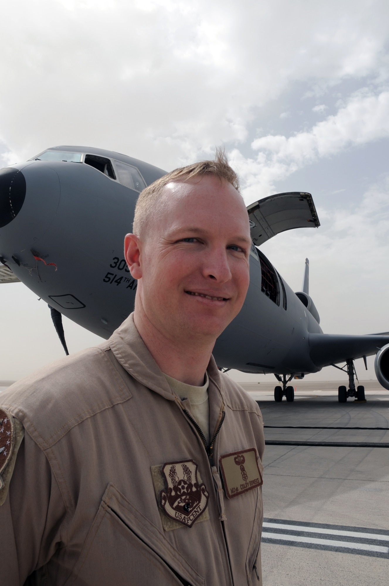 Master Sgt. Colby Bowers is an independent duty medical technician assigned to the 908th Expeditionary Air Refueling Squadron at a non-disclosed base in Southwest Asia. Here he is pictured by a KC-10 Extender on March 1, 2010. He is deployed from the U.S. Air Force Expeditionary Center's 421st Combat Training Squadron at Joint Base McGuire-Dix-Lakehurst, N.J. (U.S. Air Force Photo/Master Sgt. Scott T. Sturkol)