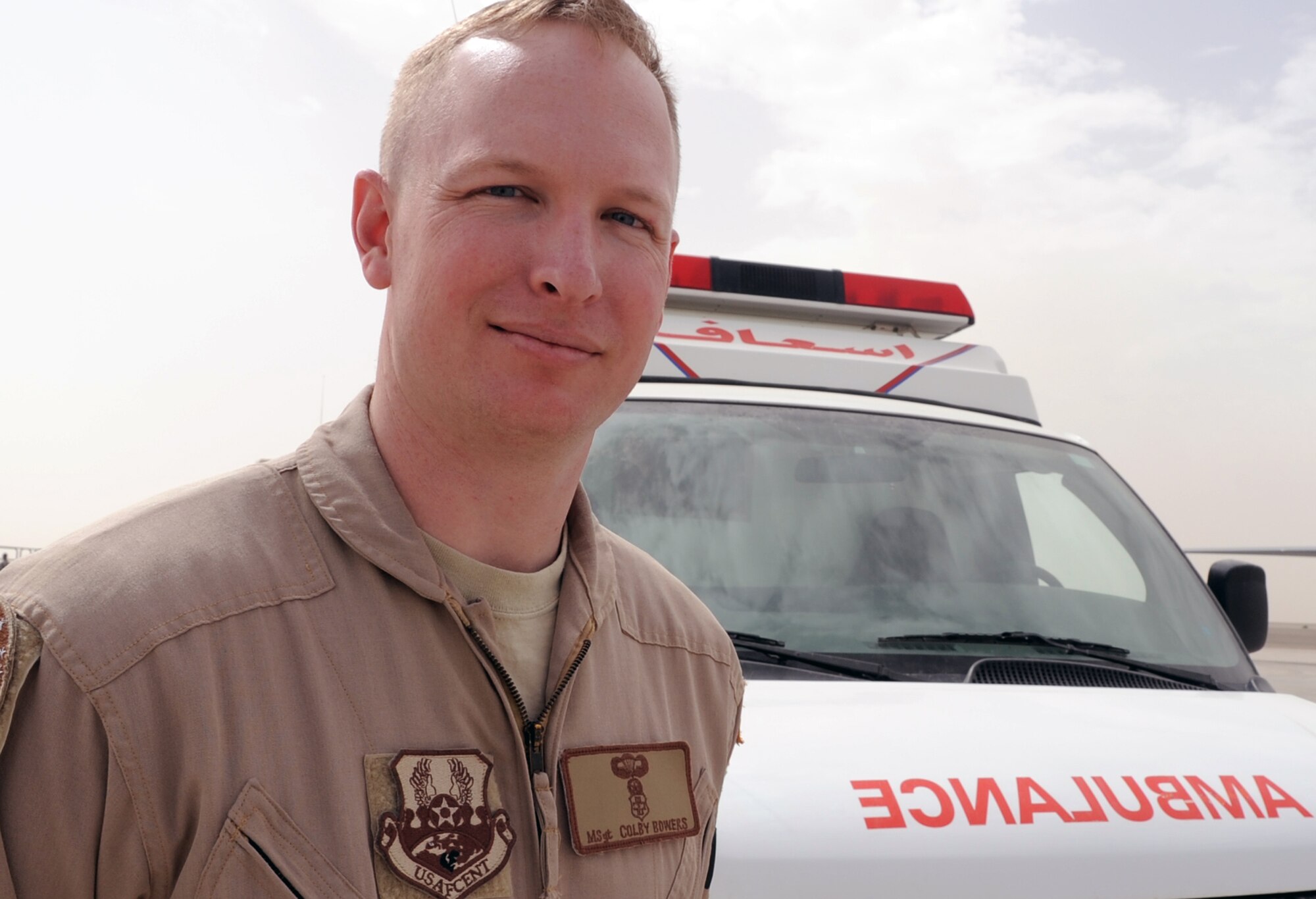 Master Sgt. Colby Bowers, an independent duty medical technician assigned to the 908th Expeditionary Air Refueling Squadron, stands near an ambulance he is qualified to use at a non-disclosed base in Southwest Asia on March 1, 2010. He is deployed from the U.S. Air Force Expeditionary Center's 421st Combat Training Squadron at Joint Base McGuire-Dix-Lakehurst, N.J. (U.S. Air Force Photo/Master Sgt. Scott T. Sturkol)