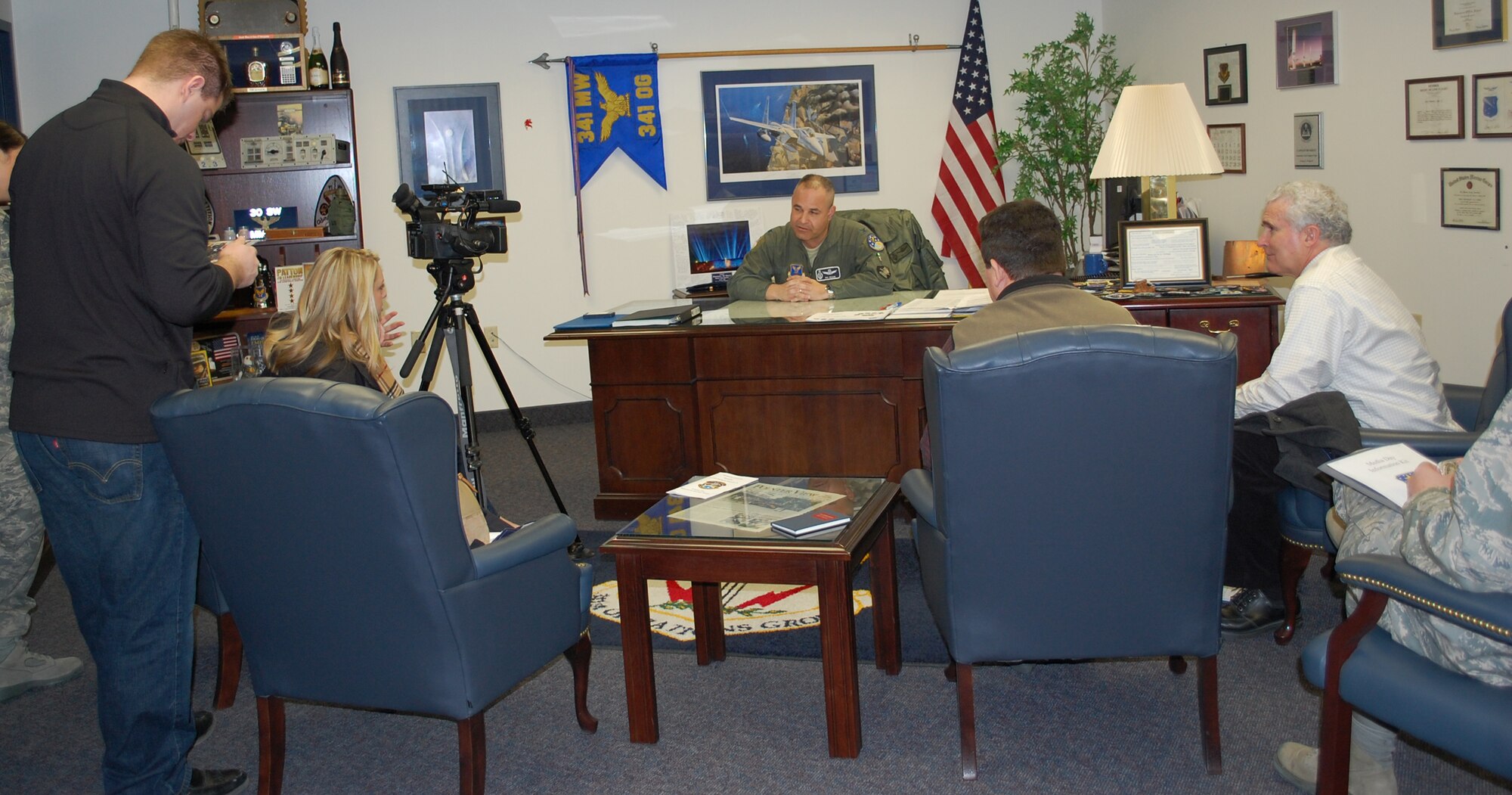 Members of the media from Great Falls interview Col. Mohammed "Mo" Khan in his office in the 341st Operations Group command suite March 3. Members of the media took part in an orientation tour which included a mission briefing, tours of the missile procedures trainer and maintenance training facility, as well as the tactical response force shoot house and EST 2000. (U.S. Air Force photo/Valerie Mullett)