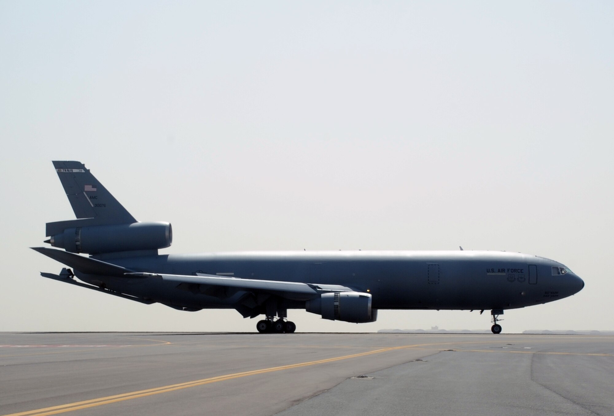 A flight crew guides a KC-10 Extender from the 908th Expeditionary Air Refueling Squadron to a landing at a non-disclosed base in Southwest Asia on March 9, 2010. The 908th EARS, as part of the 380th Air Expeditionary Wing, supports operations Iraqi Freedom and Enduring Freedom and the Combined Joint Task Force-Horn of Africa. (U.S. Air Force Photo/Master Sgt. Scott T. Sturkol/Released)