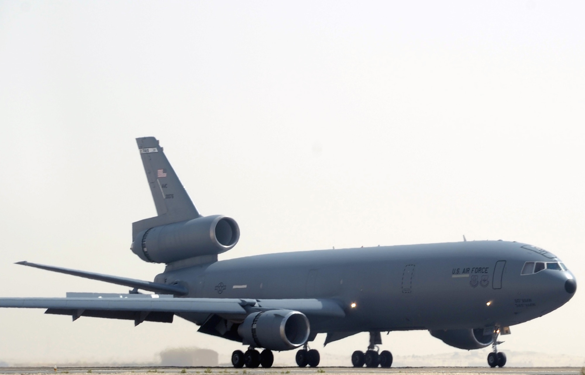 A flight crew guides a KC-10 Extender from the 908th Expeditionary Air Refueling Squadron to a landing at a non-disclosed base in Southwest Asia on March 9, 2010. The 908th EARS, as part of the 380th Air Expeditionary Wing, supports operations Iraqi Freedom and Enduring Freedom and the Combined Joint Task Force-Horn of Africa. (U.S. Air Force Photo/Master Sgt. Scott T. Sturkol/Released)