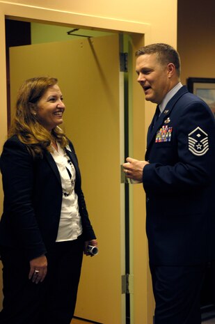 Cheryl Clark and Master Sgt. Timothy Smith converse prior to lunch at the Military/Defense Community benefit hosted by the Charleston Metro Chamber of Commerce March 11. The benefit aimed to raise money to support and enable the chamber to work with local military organizations, as well as state and federal officials to ensure defense facilities remain in the area. The chamber has been awarded the prestigious Abilene Chamber of Commerce Air Mobility Award for its outstanding support of the military three times since 2003 and is the only community to receive the award three times. Sergeant Smith is the 437th Logistics Readiness Squadron first sergeant, and Mrs. Clark is the honorary commander assigned to the 437th Airlift Wing commander. (U.S. Air Force photo/Airman 1st Class Lauren Main)