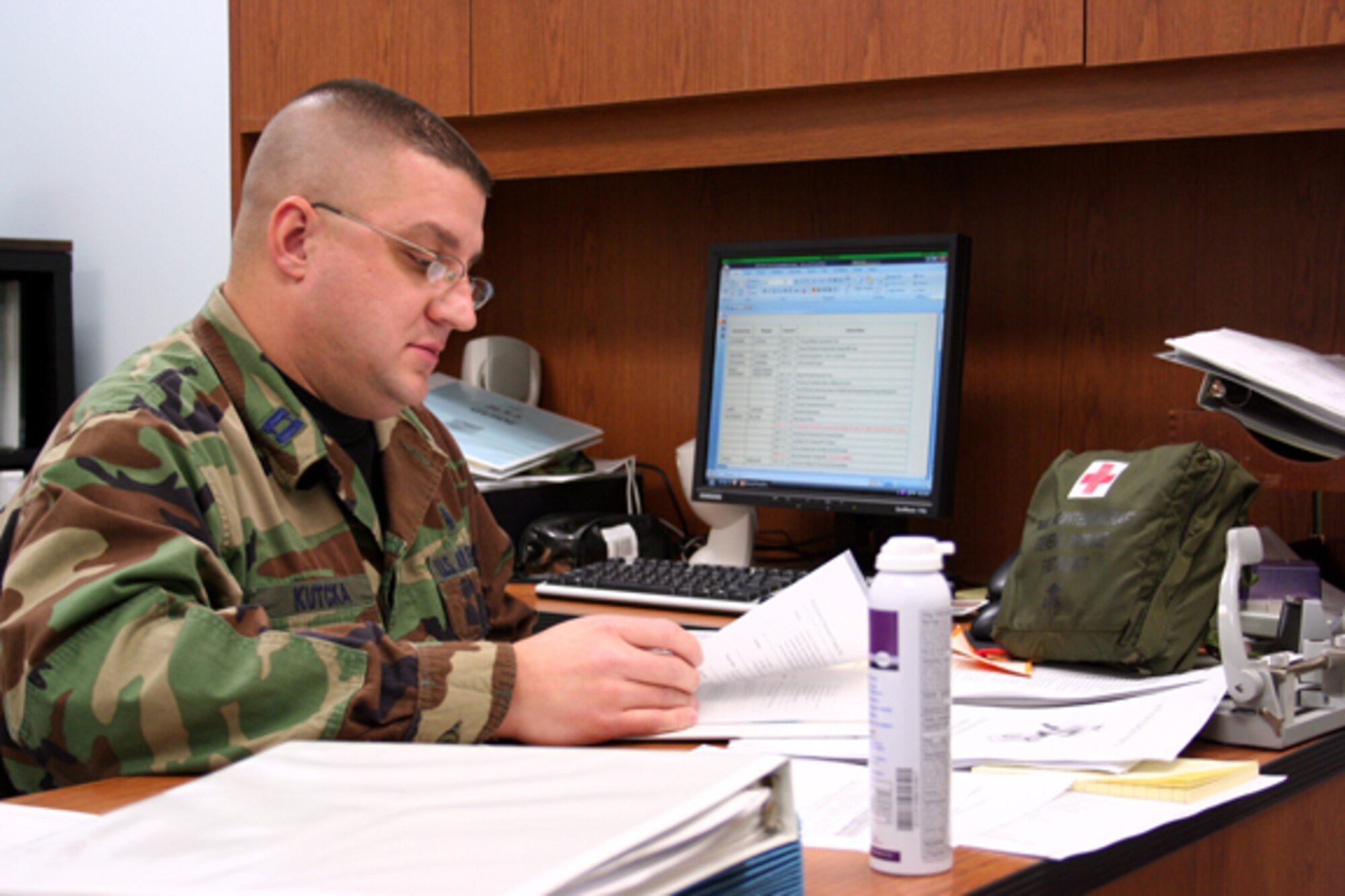 GRISSOM AIR RESERVE BASE, Ind., -- Captain John Kutcka, 434th Aerospace Medicine Squadron, conducts a self inspection of files in preparation for an upcoming review.  (U.S. Air Force photo illustration/Staff Sgt. Chris Bolen)