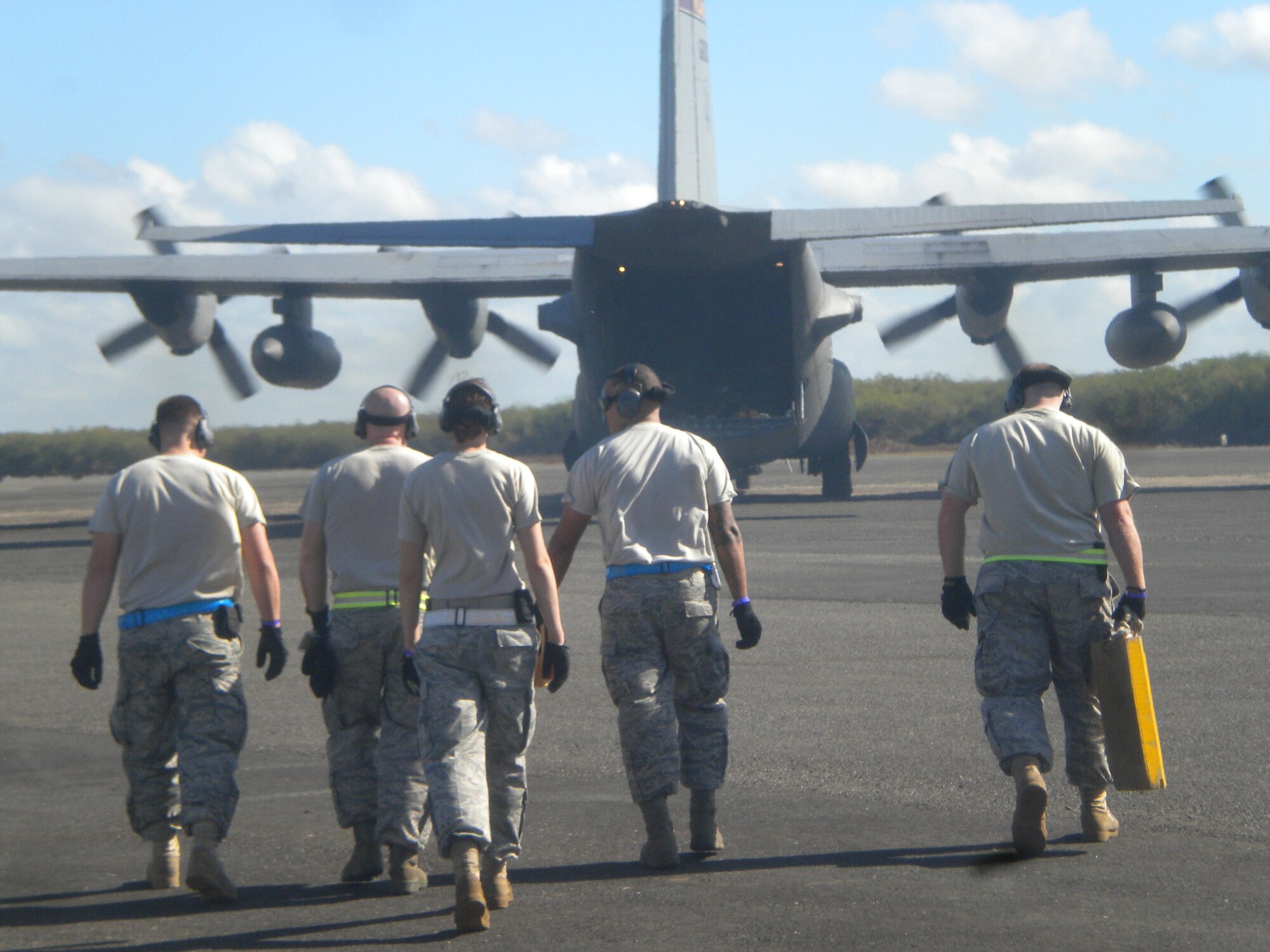 In the aftermath of the devastating earthquake that struck Haiti on Jan. 12, nearly 70 members of the 615th Contingency Response Wing deployed to the Dominican Republic in support of OPERATION UNIFIED RESPONSE. Due to overwhelming air traffic flow at Port-au-Prince International Airport, Haiti, additional locations were identified at San Isidro Air Base and Maria Montez International Airport as delivery and staging areas for humanitarian relief supplies. 615th Contingency Response Wing Airmen were called upon to assist in airfield operations. The team of experts consisted of aerial port operators, air traffic control, air transportation and maintenance personnel. They worked alongside their gracious Dominican Republic hosts in a joint interagency multi-national endeavor. The team increased operations to 24 hours-a-day. So far 615 CRW Airmen have moved more than 1 million pounds of humanitarian relief cargo and 219 American citizens and Haitian evacuees. They also established a trucking operation to move the cargo over land to Haiti and have used 34 flatbed trailers to move 131 pallets of relief supplies.