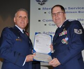 TRAVIS AIR FORCE BASE, Calif. -- At the 349th Air Mobility Wing commander’s call Mar. 7, 2010, six wing Airmen were recognized with medals for exceptional service. They are pictured here at attention prior to their presentations. From the left: Wing Commander, Col. John Flournoy; Command Chief Master Sgt. Kathleen Buckner, received the Air Force Meritorious Service Medal, second oak leaf cluster; CMSgt. Glenn Orfitelli, received the MSM, first OLC; Capt. Rachel Alvarez Montiel received the Air Force Commendation Medal; Tech. Sgt. Glen Miller received the Air Force Achievement Medal, fifth OLC; TSgt. Timothy Stotenburg received the AFAM, first OLC and TSgt. Jonathan Caraballo received the AFAM. (U.S. Air Force photo/Senior Master Sgt. Ellen Hatfield) 