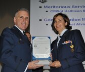 TRAVIS AIR FORCE BASE, Calif. -- At the 349th Air Mobility Wing commander’s call Mar. 7, 2010, six wing Airmen were recognized with medals for exceptional service. They are pictured here at attention prior to their presentations. From the left: Wing Commander, Col. John Flournoy; Command Chief Master Sgt. Kathleen Buckner, received the Air Force Meritorious Service Medal, second oak leaf cluster; CMSgt. Glenn Orfitelli, received the MSM, first OLC; Capt. Rachel Alvarez Montiel received the Air Force Commendation Medal; Tech. Sgt. Glen Miller received the Air Force Achievement Medal, fifth OLC; TSgt. Timothy Stotenburg received the AFAM, first OLC and TSgt. Jonathan Caraballo received the AFAM. (U.S. Air Force photo/Senior Master Sgt. Ellen Hatfield) 