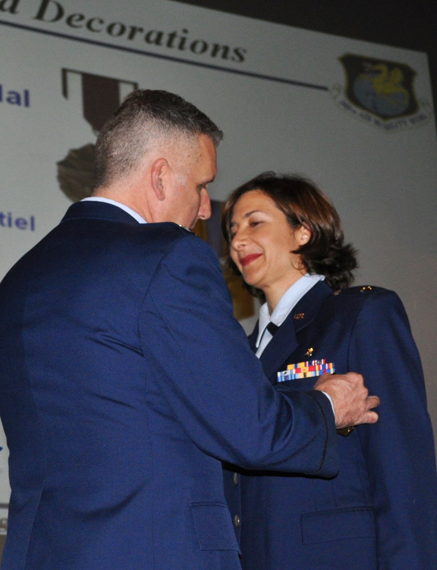 TRAVIS AIR FORCE BASE, Calif. -- At the 349th Air Mobility Wing commander’s call Mar. 7, 2010, six wing Airmen were recognized with medals for exceptional service. They are pictured here at attention prior to their presentations. From the left: Wing Commander, Col. John Flournoy; Command Chief Master Sgt. Kathleen Buckner, received the Air Force Meritorious Service Medal, second oak leaf cluster; CMSgt. Glenn Orfitelli, received the MSM, first OLC; Capt. Rachel Alvarez Montiel received the Air Force Commendation Medal; Tech. Sgt. Glen Miller received the Air Force Achievement Medal, fifth OLC; TSgt. Timothy Stotenburg received the AFAM, first OLC and TSgt. Jonathan Caraballo received the AFAM. (U.S. Air Force photo/Senior Master Sgt. Ellen Hatfield) 