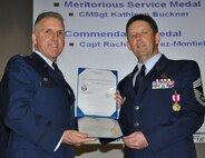 TRAVIS AIR FORCE BASE, Calif. -- At the 349th Air Mobility Wing commander’s call Mar. 7, 2010, six wing Airmen were recognized with medals for exceptional service. They are pictured here at attention prior to their presentations. From the left: Wing Commander, Col. John Flournoy; Command Chief Master Sgt. Kathleen Buckner, received the Air Force Meritorious Service Medal, second oak leaf cluster; CMSgt. Glenn Orfitelli, received the MSM, first OLC; Capt. Rachel Alvarez Montiel received the Air Force Commendation Medal; Tech. Sgt. Glen Miller received the Air Force Achievement Medal, fifth OLC; TSgt. Timothy Stotenburg received the AFAM, first OLC and TSgt. Jonathan Caraballo received the AFAM. (U.S. Air Force photo/Senior Master Sgt. Ellen Hatfield) 