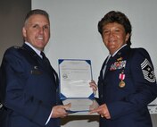 TRAVIS AIR FORCE BASE, Calif. -- At the 349th Air Mobility Wing commander’s call Mar. 7, 2010, six wing Airmen were recognized with medals for exceptional service. They are pictured here at attention prior to their presentations. From the left: Wing Commander, Col. John Flournoy; Command Chief Master Sgt. Kathleen Buckner, received the Air Force Meritorious Service Medal, second oak leaf cluster; CMSgt. Glenn Orfitelli, received the MSM, first OLC; Capt. Rachel Alvarez Montiel received the Air Force Commendation Medal; Tech. Sgt. Glen Miller received the Air Force Achievement Medal, fifth OLC; TSgt. Timothy Stotenburg received the AFAM, first OLC and TSgt. Jonathan Caraballo received the AFAM. (U.S. Air Force photo/Senior Master Sgt. Ellen Hatfield) 