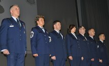 TRAVIS AIR FORCE BASE, Calif. -- At the 349th Air Mobility Wing commander’s call Mar. 7, 2010, six wing Airmen were recognized with medals for exceptional service. They are pictured here at attention prior to their presentations. From the left: Wing Commander, Col. John Flournoy; Command Chief Master Sgt. Kathleen Buckner, received the Air Force Meritorious Service Medal, second oak leaf cluster; CMSgt. Glenn Orfitelli, received the MSM, first OLC; Capt. Rachel Alvarez Montiel received the Air Force Commendation Medal; Tech. Sgt. Glen Miller received the Air Force Achievement Medal, fifth OLC; TSgt. Timothy Stotenburg received the AFAM, first OLC and TSgt. Jonathan Caraballo received the AFAM. (U.S. Air Force photo/Senior Master Sgt. Ellen Hatfield) 