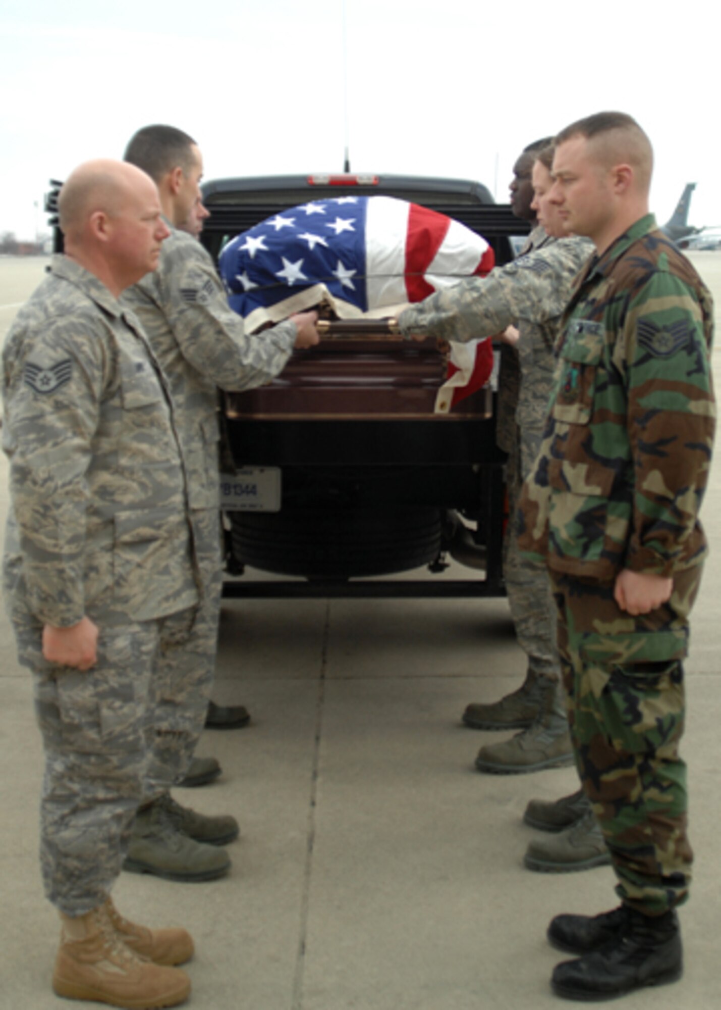 GRISSOM AIR RESERVE BASE, Ind. -- Members of the Grissom ARB honor guard, aerial port flight, and chaplain's office recently practied the honors given to fallen servicemembers during dignified transfers of human remains. This training reinforced the fact that at any time, an Airman may be called upon to assist in the dignified transfer of remains.  (U.S. Air Force photo/Senior Airman Carl Berry)