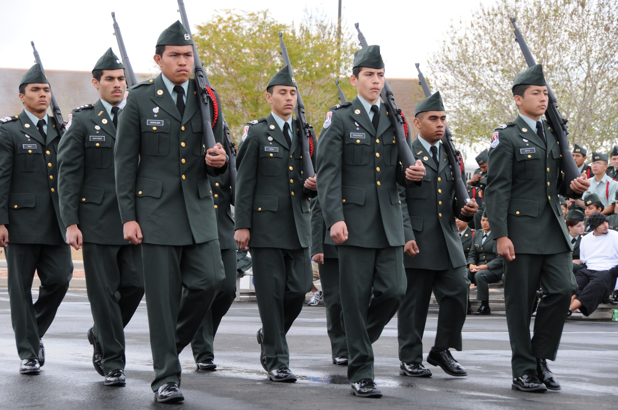 An Army Junior ROTC drill team marches onto the drill pad to perform during a drill team competition at the base February 20, 2010. This is the tenth annual competition hosted by the 161st Air Refueling Wing. (U.S. Air Force Photo by Senior Airman Nicole Enos)