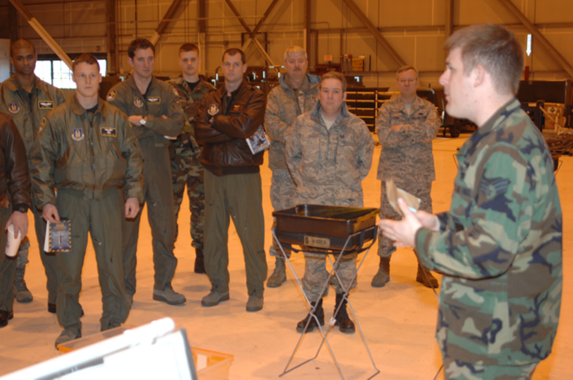 GRISSOM AIR RESERVE BASE, Ind., -- 434th Air Refueling Wing personnel are briefed on the different steps used in the chemical decontamination process.  (U.S. Air Force photo/Seniro Airman Carl Berry)
