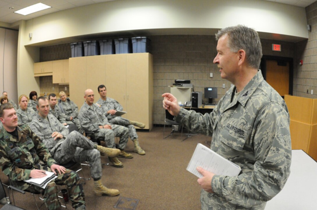 Col. Ron Solberg, the 119th Support Group Commander, right, addresses full-time North Dakota Air National Guard personnel Mar. 15, as he initiates personnel mobilization plans for the regional flood fight beginning in the Red River Valley, Fargo, N.D.  The North Dakota National Guard plan calls for 300-400 personnel to be voluntarily placed on state active duty orders within 24-hours.  The plans provide for all of the same flood fighting missions that the N.D. National Guard provided in the historic flood fight in the spring of 2009.   (DoD photo by Senior Master Sgt. David H. Lipp) (Released)