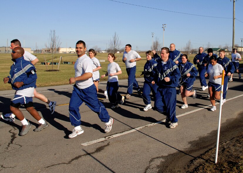 Members of the 914th Airlift Wing run as part of their annual AF Fitness Testing, April 2009, Niagara Falls Air Reserve Station, NY. The Air Force Fitness Test is designed to test the body composition, muscular strength/endurance and cardiovascular respiratory fitness of Airmen in the U.S. Air Force.(U.S. Air Force photo by Michael Harvey) 