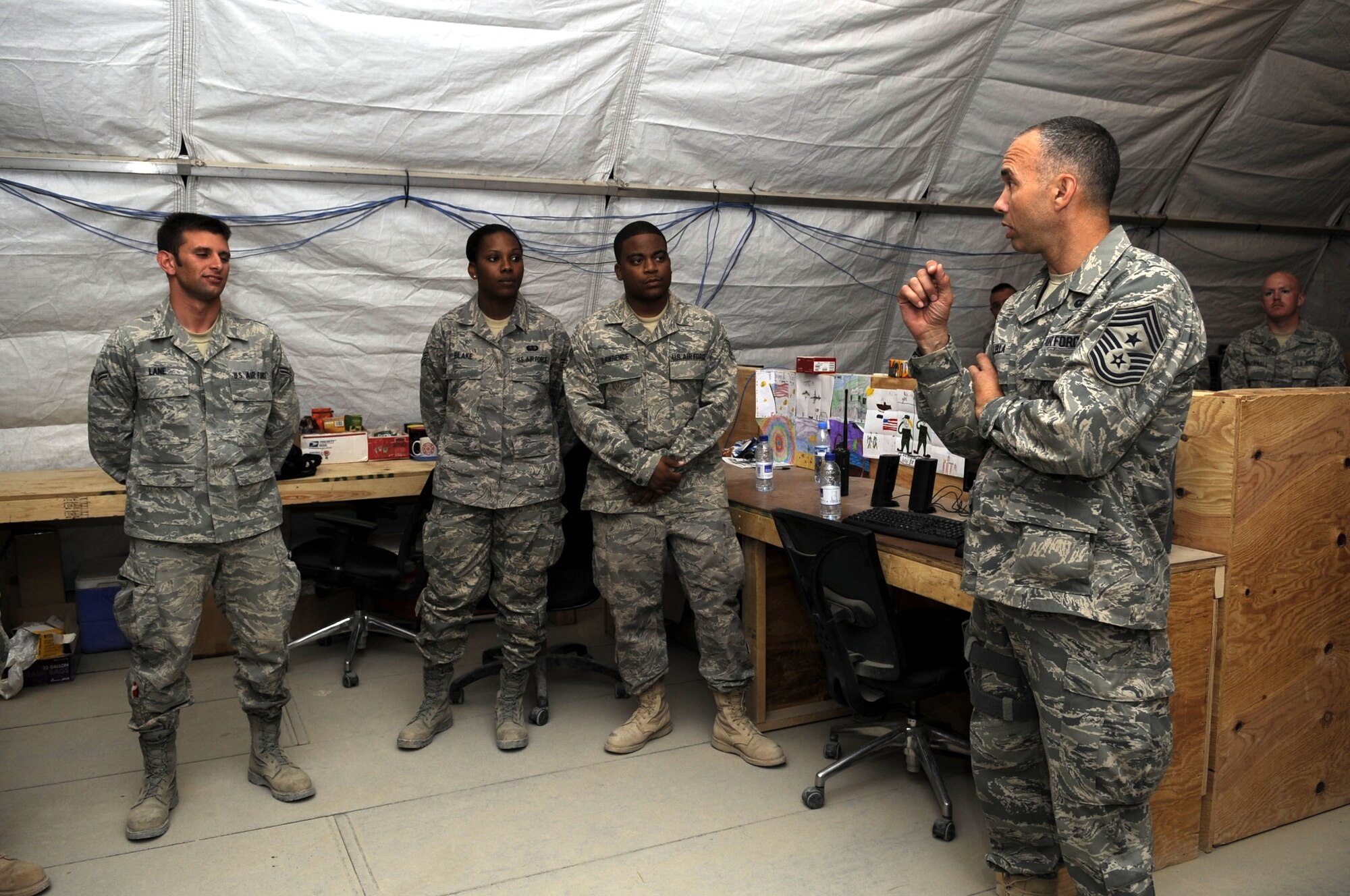 The Command Chief for U. S. Air Forces Central, Southwest Asia, Chief Master Sgt. Mark J. Villella, meets with members of the 451st Expeditionary Civil Engineer Squadron. (U.S Air Force photo by Senior Airman Nancy Hooks/Released)
