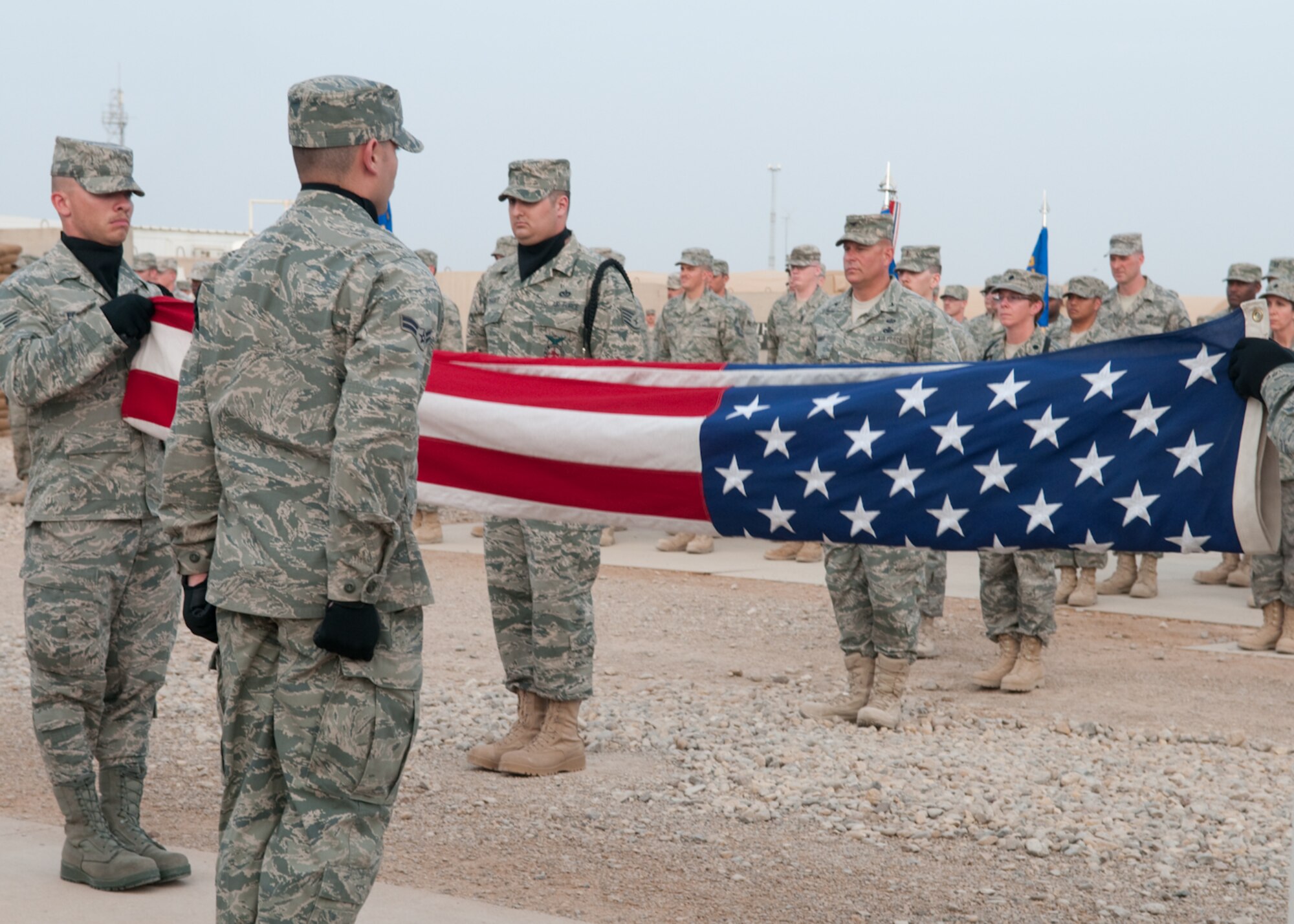 Col. Lou Danner, commander, 407th Air Expeditionary Group, presides over the drawdown retreat at Memorial Plaza, Ali Base, Iraq, March 12, 2010. It’s business as usual at Ali Base as the drawdown continues.  (U.S. Air Force photo by Senior Master Sgt. Elizabeth Gilbert/released)
