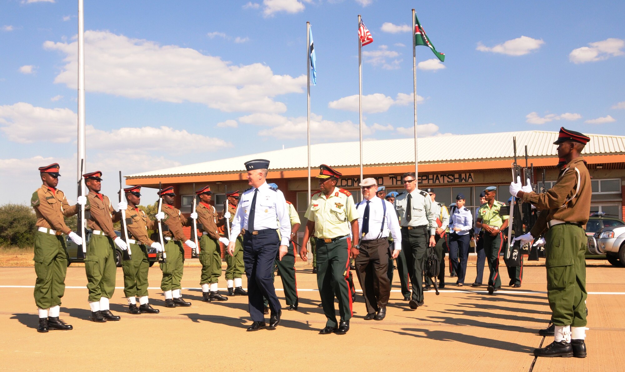GABORONE, Botswana – Maj. Gens. Ronald Ladnier (left), commander of 17th Air Force (Air Forces Africa) and T.M. Paledi, commander of the Air Arm, Botswana Defense Force, prepare to depart Thebephatshwa Air Base March 10 after touring the installation. The two Generals and their staffs discussed the ongoing cooperation between the BDF and AFAFRICA during General Ladnier’s senior leader engagement in the country March 9-11. Following the Generals are AFAFRICA Foreign Policy Advisor Brent Bohne, and Army Lt. Col. Tim Wyatt, U.S. Embassy Office of Security Cooperation. (U.S. Air Force photo by Master Sgt. Jim Fisher)