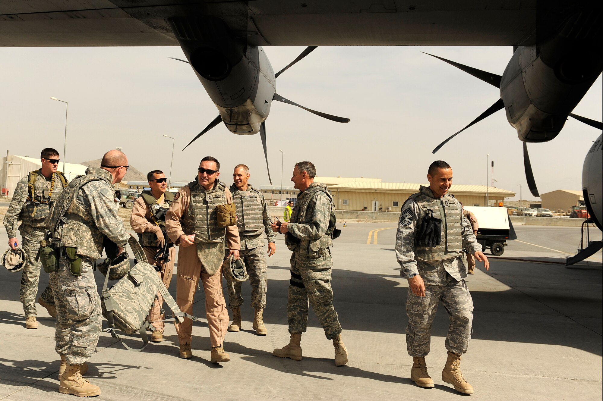 U.S. Air Force Maj. Gen. Stephen Mueller, director, Air Component Coordination Element, Air Force Central Command, boards a C-130J on his way to Forward Operating Base Tarin Kowt, Afghanistan March 14, 2010. (U.S. Air Force photo by/ Tech. Sgt. Jeromy K. Cross/released)