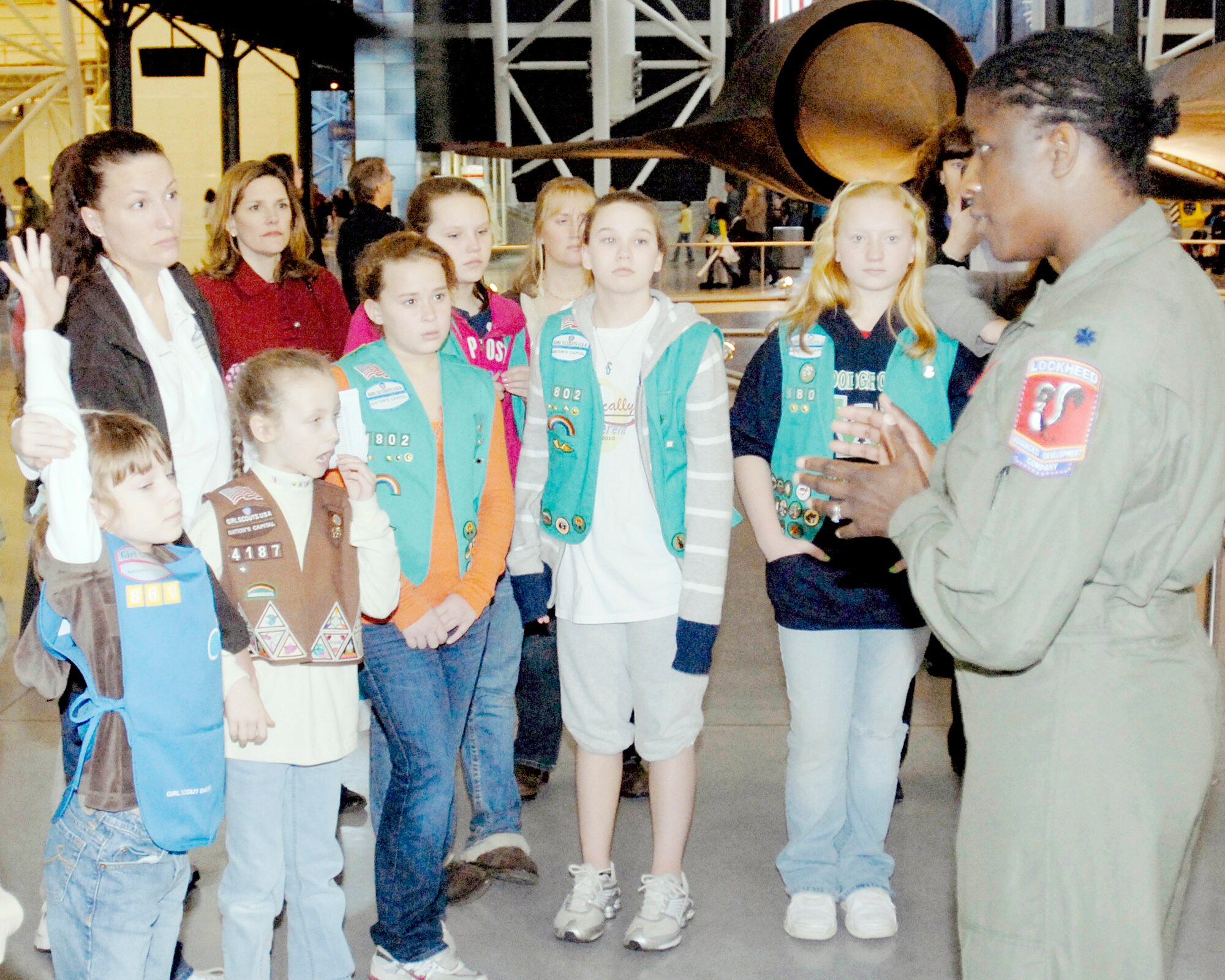 Lt. Col. Merryl Tengesdal answers questions about being a U-2 pilot during the annual Women in Aviation and Space Family Day at the National Air and Space Museum Udvar-Hazy Center in Chantilly, Va., March 13, 2010. Airmen had the chance to talk to young girls about being female aviators. Colonel Tengesdal is the Detachment 2 commander for flight testing at Edwards Air Force Base, Calif. (U.S. Air Force photo/Staff Sgt. J.G. Buzanowski)