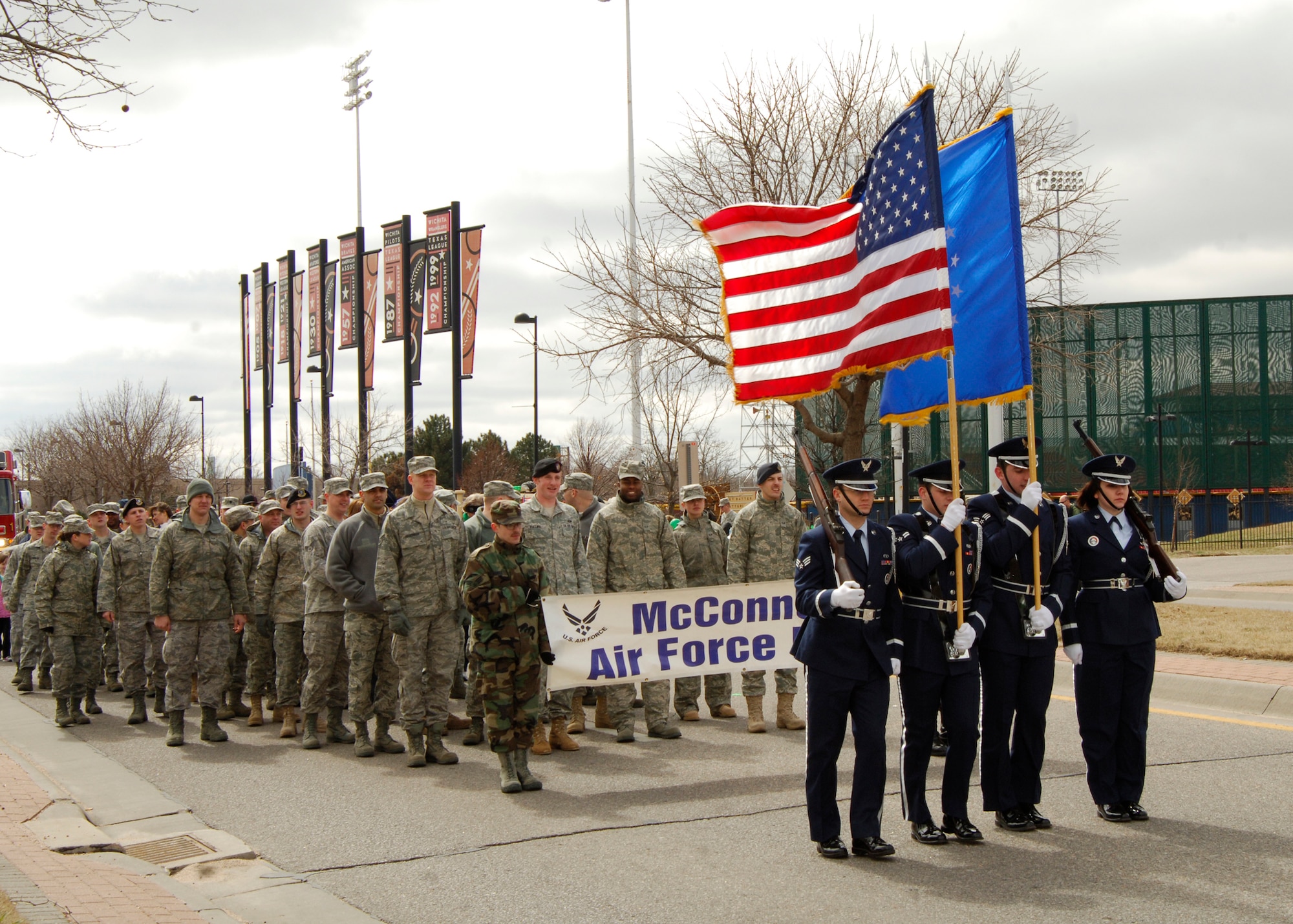 Team McConnell Airmen walk in downtown Wichita, Kan., during the annual St. Patrick’s Day Parade, March 13, 2010. More than 50 members of McConnell helped the city celebrate this “green” holiday by showing their patriotism and dedication to their country. The base is host to more than 5,600 Airmen, Guardsmen, Reservists and civilian employees, and in fiscal year 2009, McConnell generated more than $450 million into the local economy. (U.S. Air Force photo / Airman 1st Class Andrea Salazar)