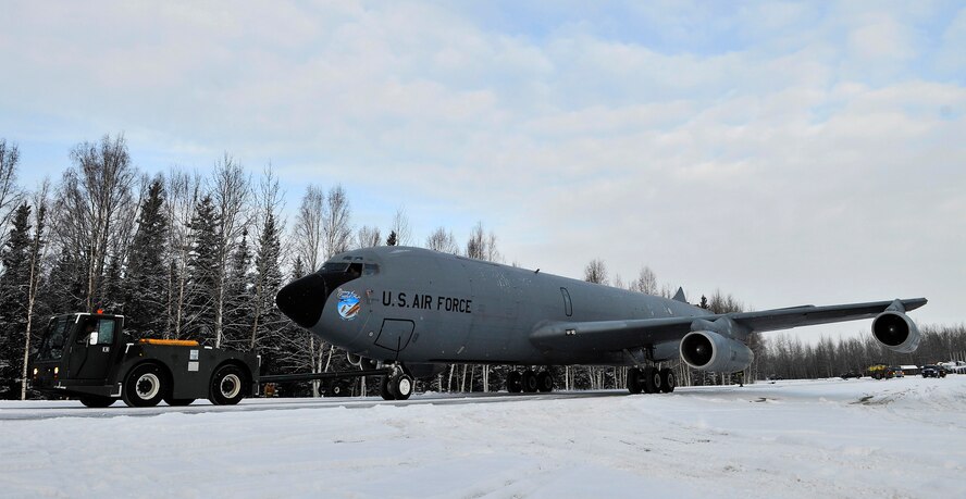 A KC-135 is pulled to its finally resting place to be showcased as a static display at Heritage Park Mar. 15, 2010, Eielson Air Force Base, Alaska. Airmen from the 354th Fighter Wing and the 168th Air Refueling Wing helped relocate KC-135, which belongs to the 168th ARW. (U.S. Air Force photo/Staff Sgt. Christopher Boitz)