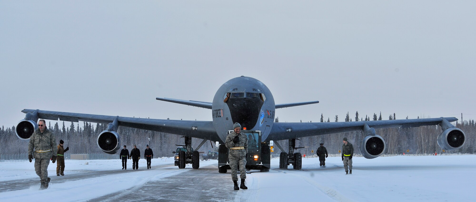 A KC-135 is pulled down the street to be showcased as a static display at Heritage Park Mar. 15, 2010, Eielson Air Force Base, Alaska. Airmen from the 354th Fighter Wing and the 168th Air Refueling Wing helped relocate KC-135, which belongs to the 168th ARW. (U.S. Air Force photo/Staff Sgt. Christopher Boitz)
