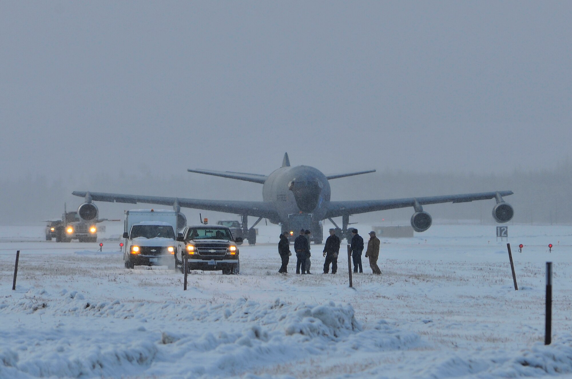 A KC-135 is pulled through frozen ground covered in snow to be showcased as a static display at Heritage Park Mar. 15, 2010, Eielson Air Force Base, Alaska. Airmen from the 354th Fighter Wing and the 168th Air Refueling Wing helped relocate KC-135, which belongs to the 168th ARW. (U.S. Air Force photo/Staff Sgt. Christopher Boitz)