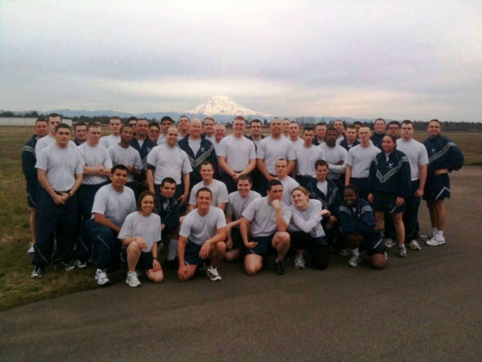 Airmen from the 62nd Aerial Port Squadron here, along with Airmen from the 56th Aerial Port Squadron from March Air Reserve Base, Calif., complete a 5-mile run as part of their physical training session recently. (Courtesy photo)