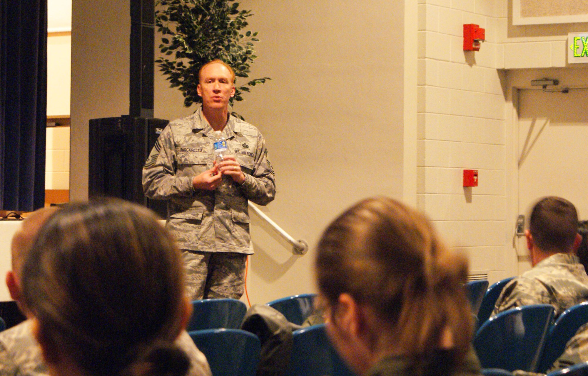 Air Force Reserve Manpower Superintendent Chief Master Sgt. James Pascarella talks personnel, manpower and services with Airmen during the 310th Space Wing enlisted call on March 6 at the auditorium on Peterson Air Force Base, Colo. (U.S. Air Force photo by Master Sgt. Scott Westfall)
