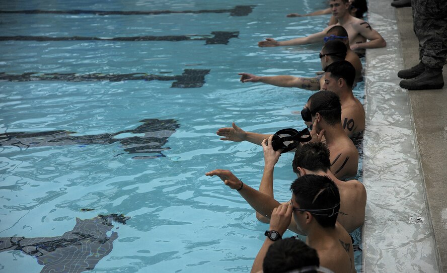 Eighteen special tactics candidates took the Physical Ability Stamina Test held March 12 at Hurlburt Field, Fla.  Hosted by the Air Force Special Operations Training Center, candidates had to pass every element of the PAST, including the 20-meter underwater swim, to qualify for combat control, pararescue, special operations weather or the combat rescue officer career fields.  (U.S. Air Force photo by Master Sgt. Russell E. Cooley IV) (Released)
