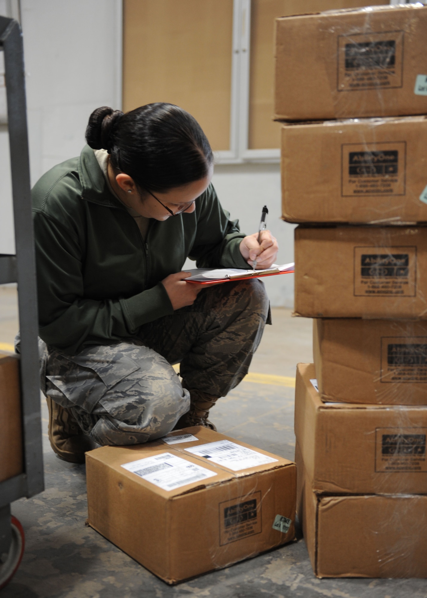 DYESS AIR FORCE BASE, Texas—Airman 1st Class Laura Jimenez, 7th Logistics Readiness Squadron, checks inbound cargo March 16 at the traffic management warehouse here. All inbound cargo must be checked and matched with paperwork before it can be turned over to supply. (U.S. Air Force photo/ Airman 1st Class Brittney Prescott)