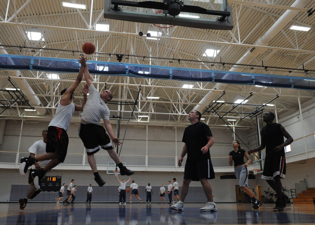 DYESS AIR FORCE BASE, Texas – Dyess Airmen play basketball March 12 at the Dyess fitness center here. The Dyess fitness center hosted a 3-on-3 basketball tournament consisting of 3 teams that competed with each other in several 10 minute games. (U.S. Air Force photo/ Airman 1st Class Brittney Prescott)
