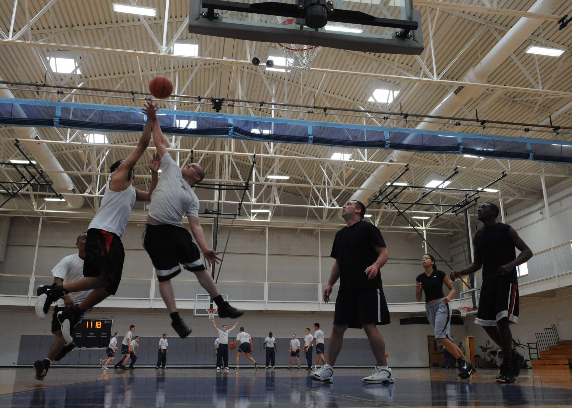DYESS AIR FORCE BASE, Texas – Dyess Airmen play basketball March 12 at the Dyess fitness center here. The Dyess fitness center hosted a 3-on-3 basketball tournament consisting of 3 teams that competed with each other in several 10 minute games. (U.S. Air Force photo/ Airman 1st Class Brittney Prescott)