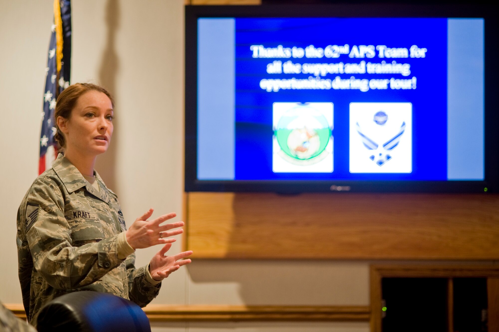 Master Sgt. Sarah Kraft, 56th Aerial Port Squadron team chief, discusses the experience the Reserve Airmen had and what training they received in a briefing with 62nd Aerial Port Squadron leadership March 11. (U.S. Air Force photo/Abner Guzman)