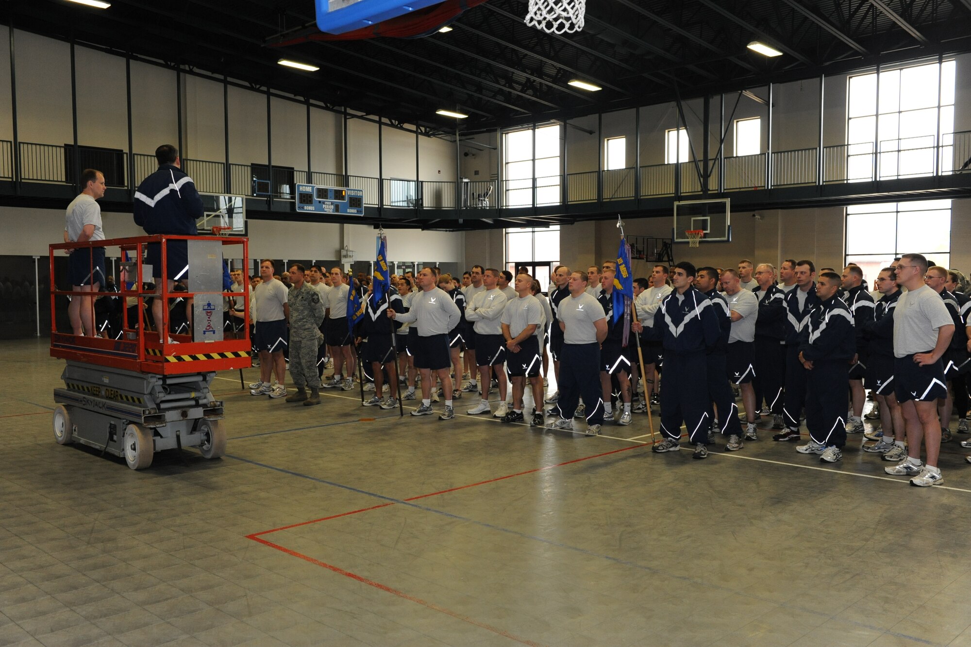 Col. Greg Otey, 19th Airlift Wing commander, briefs base personnel March 12 at the fitness center on the results of the recent base wide Defense Equal Opportunity Climate Survey. He said commanders and supervisors at all levels can use the results of the DEOCS to improve base work environments. (U.S. Air Force photo by Senior Airman Ethan Morgan)