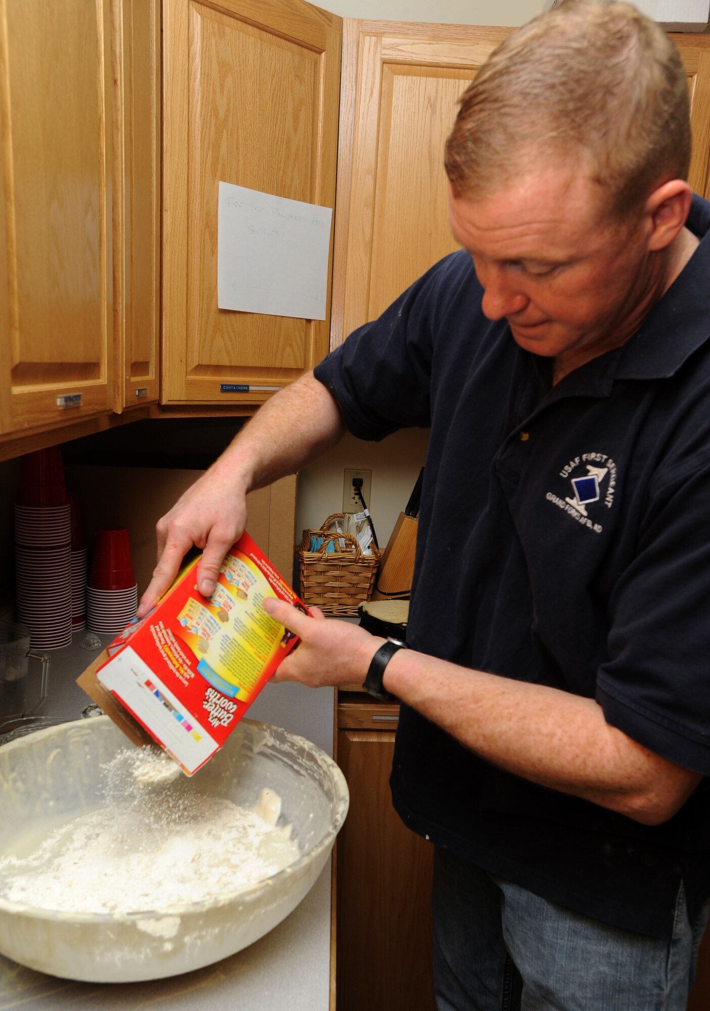 Master Sgt. Fredrick Wetzel, 319th Operations Group first sergeant, mixes pancake batter March 16 at Sven’s Den on Grand Forks Air Force Base, N.D.  The base’s first sergeants held a breakfast to raise money for Airmen. (U.S. Air Force photo by Airman 1st Class Amber Price)