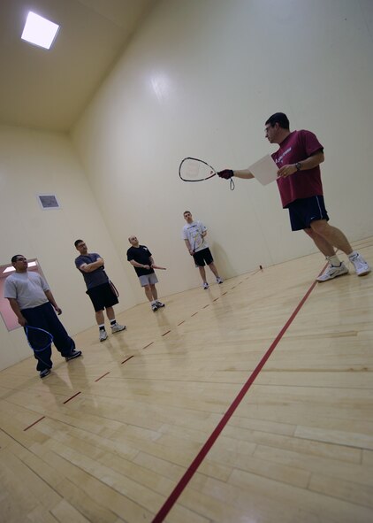 MINOT AIR FORCE BASE, N.D. – Master Sgt. John Tinker, 5th Munitions Squadron assistant armament flight chief, goes over the basics of racquetball at the McAdoo Sports and Fitness Center on Miont Air Force base March 12. The fitness center held a free racquetball clinic, which included rules, terminology and techniques. (U.S. Air Force photo by Senior Airman Sharida Jackson)
