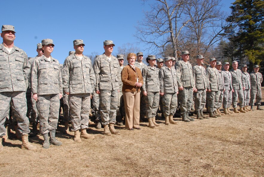 The Honorable M. Jodi Rell, governor of Connecticut, “falls in” with the troops of the 103rd Maintenance Squadron’s Centralized Intermediate Repair Facility for a photo opportunity after throwing the first shovelful of dirt during a groundbreaking ceremony to celebrate the start of construction on the CIRF. The new facility will boost work and training space to roughly 30,000 square feet and will house approximately 80 technicians that work on the engines for Air National Guard and active-duty A-10s. (U.S. Air Force photo by Tech. Sgt. Erin McNamara)
