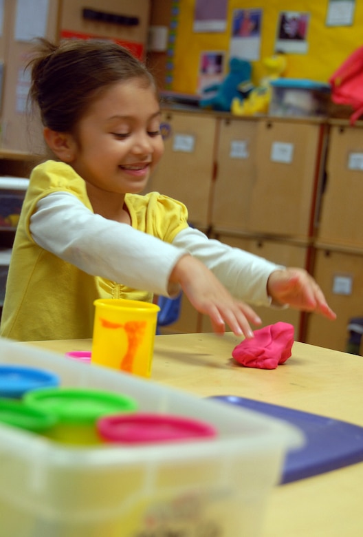 Ariana Ruiz plays with playdough during the School Age Program at the Youth Programs Center March 12. The School Age Program strives to provide the best care possible to children while they learn through play. Ariana is the daughter of Staff Sgt. Michael Ruiz. (U.S. Air Force photo/Senior Airman Timothy Taylor)