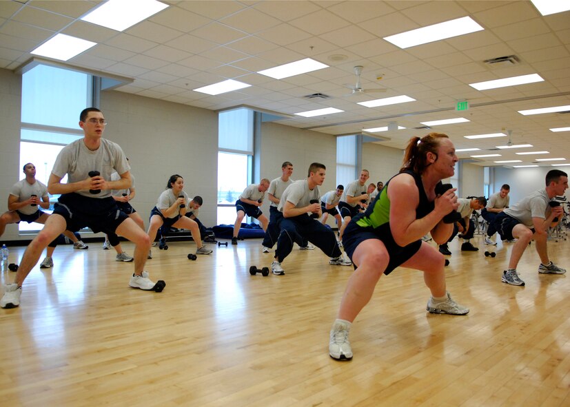 MINOT AIR FORCE BASE, N.D. -- Kris Stibers, contracted fitness instructor, leads the first term Airman in a Fit-to-Fight fitness class at the McAdoo Sports and Fitness Center at Minot Air Force base Feb. 10. First term Airmen are required to do physical fitness three times a week to ensure they stay in good physical condition. (U.S. Air Force photo by Airman 1st Class Ashley N. Avecilla)