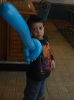 MINOT AIR FORCE BASE, N.D. -- Justin, age 5, tests out a sword Dizzy created at the Jimmy Doolittle Center March 14. Dizzy appears at every Sunday brunch at J.R. Rockers for family night, along with many public appearances for the Shriners. (U.S. Air Force photo by Laurie Arellano)