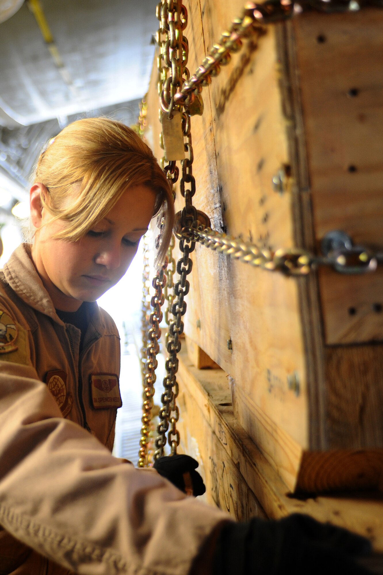 Senior Airman Spencer Keeley, 816th Expeditionary Airlift Squadron loadmaster, loads a pallet on a C-17 Globemaster III at a non-disclosed Southwest Asia location March 10, 2010. Airman Keeley was part of an all-female crew in honor of Women's History Month and is deployed from the 14th Airlift Squadron. (U.S. Air Force photo by Senior Airman Kasey Zickmund)