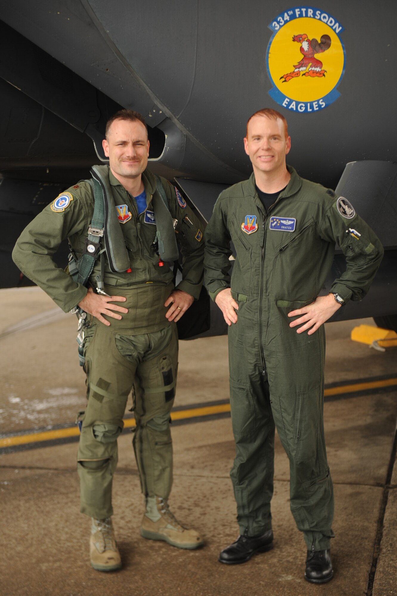 Lt. Col. Jason Brenneman, 4th Operations Support Squadron operations flight commander, and  Maj. John Fotheringham, 4th Training Squadron chief of courseware development, take a moment to commemorate Brenneman's final flight in the F-15E Strike Eagle on Seymour Johnson Air Force Base, N.C., March 12, 2010. Brenneman has been flying for more than 16 years. Brenneman hails from Lexington, Mo., and Fotheringham is from Harrison, Neb. (U.S. Air Force photo/Senior Airman Ciara Wymbs) 