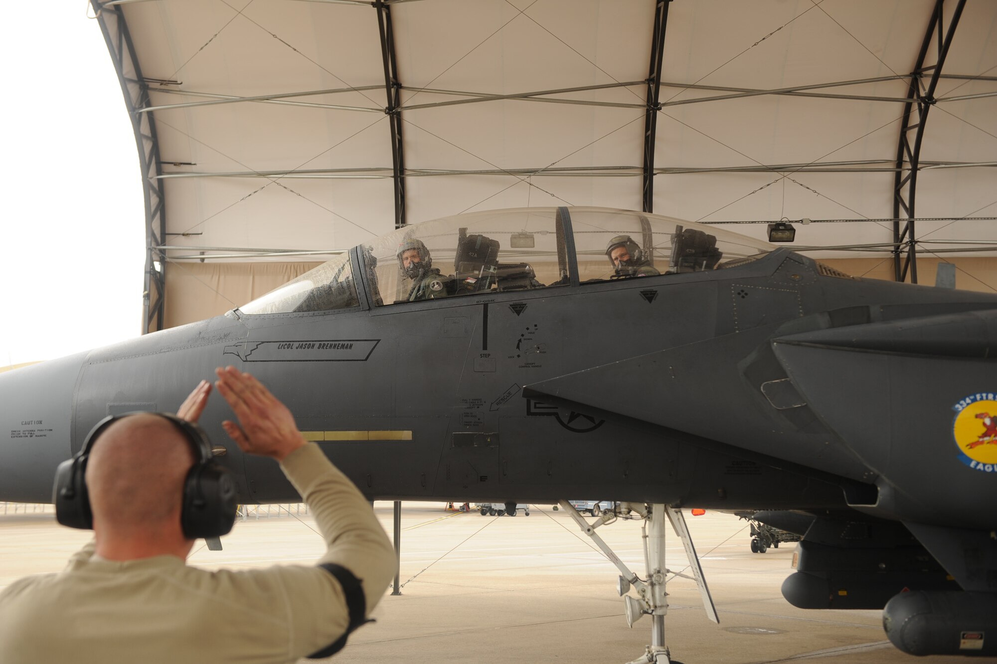 Lt. Col. Jason Brenneman, 4th Operations Support Squadron operations flight commander, and Maj. John Fotheringham, 4th Training Squadron chief of courseware development, taxi in after completing Brenneman's final flight in the F-15E Strike Eagle on Seymour Johnson Air Force Base, N.C., March 12, 2010. Brenneman is conducting a permanent change of station to the Air Force Academy as the airfield director of operations. Brenneman is from Lexington, Mo., and Fotheringham hails from Harrison, Neb.(U.S. Air Force photo/Senior Airman Ciara Wymbs) 