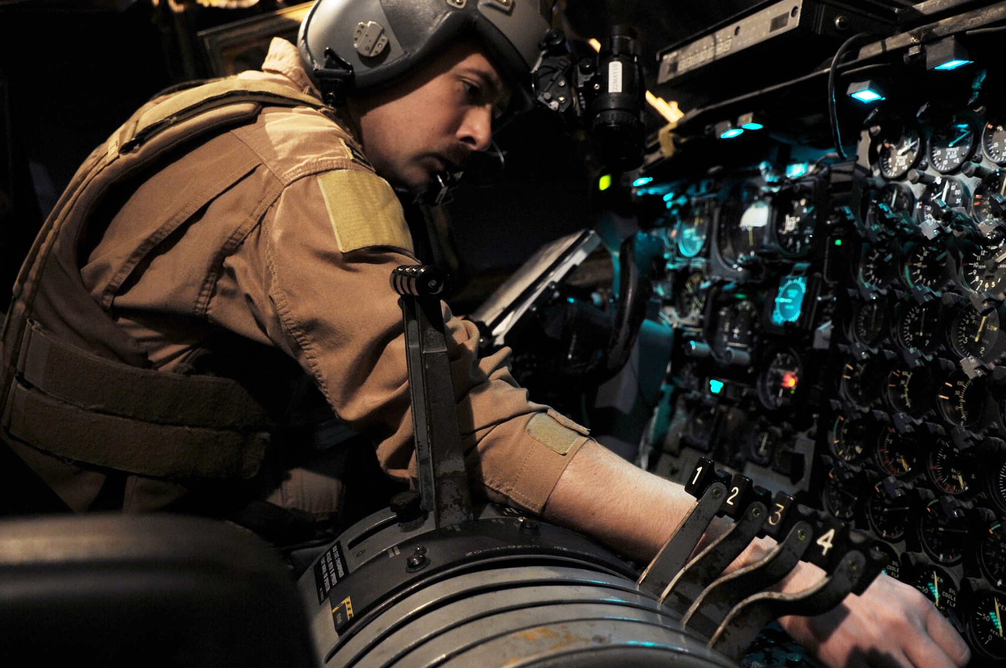 Capt. David Jones does a pre-flight check of a C-130E Hercules before its last combat mission March 6, 2010, at Joint Base Balad, Iraq. Captain Jones is a copilot assigned to the 777th Expeditionary Airlift Squadron. (U.S. Air Force photo/Senior Airman Brittany Y. Bateman)