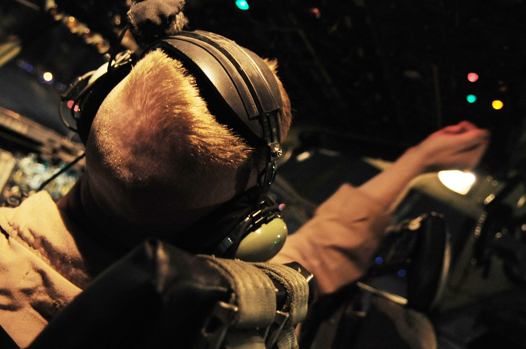 Tech Sgt. John Bohman does a pre-flight check of a C-130E Hercules before its last combat mission March 6, 2010, at Joint Base Balad, Iraq. Sergeant Bohman is a flight engineer assigned to the 777th Expeditionary Aircraft Maintenance Unit. (U.S. Air Force photo/Senior Airman Brittany Y. Bateman)