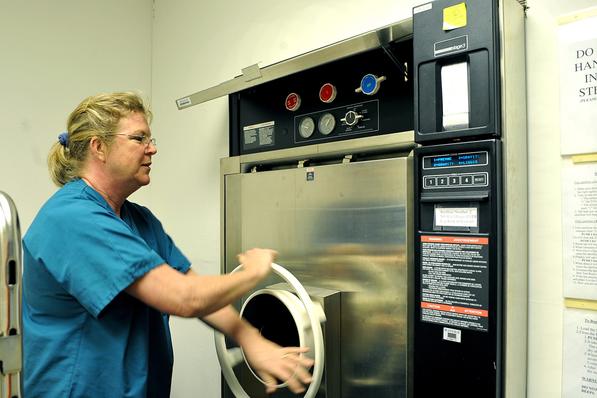 OFFUTT AIR FORCE BASE, Neb. - Shuren Lane, with the 55th Dental Squadron, at the Ehrling Bergquist Clinic cranks open an instrument sterilizer inside the dental facility March 11. The 55th DS's orthodontics section provides support to an average of 150-200 patients each month for dental services and treatment.   

U.S. Air Force photo by Charles Haymond